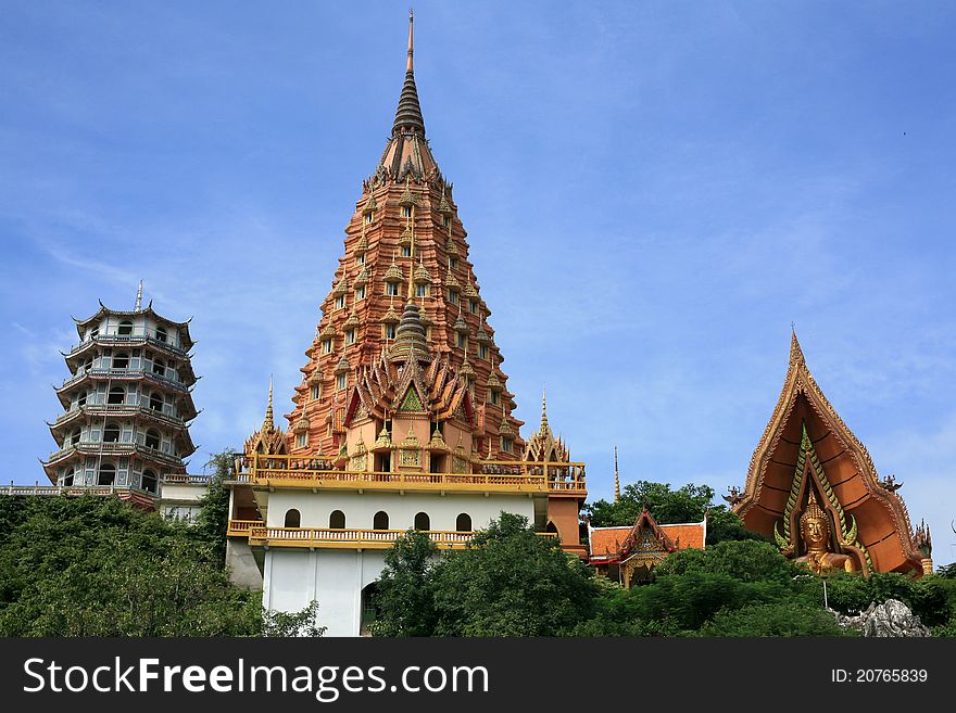 Beautiful Thai temple which has wonderful scuba and big Buddha monument is located on the hill with nice sky. Beautiful Thai temple which has wonderful scuba and big Buddha monument is located on the hill with nice sky