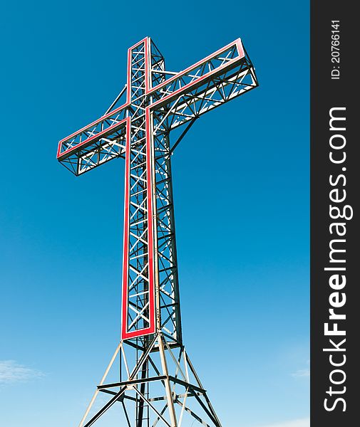 Holy cross monument at the top of a hill