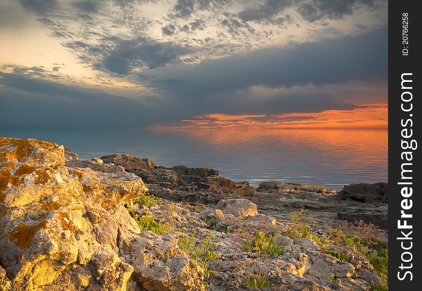 Sea and rock at the sunset