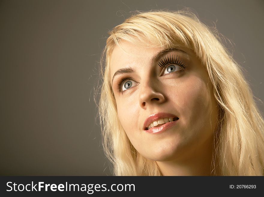 Portrait of woman thinking and looking up. Portrait of woman thinking and looking up