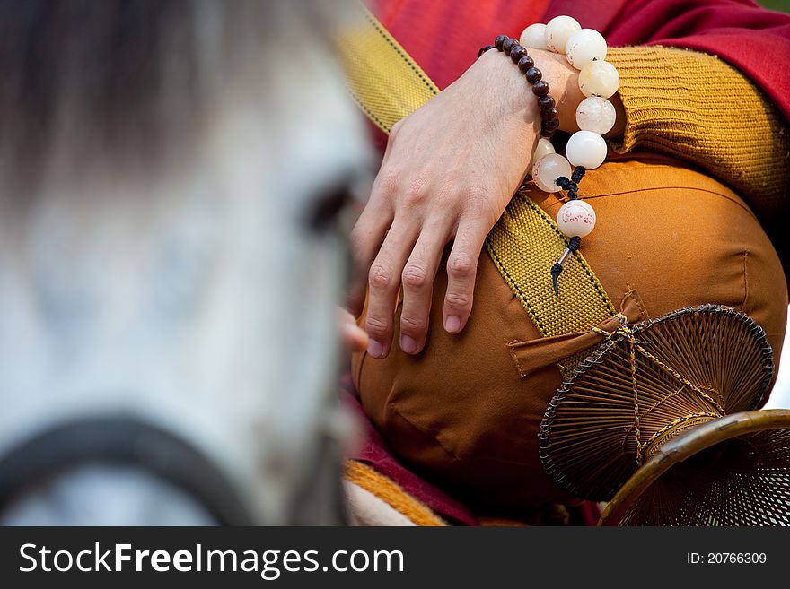 Red buddhist monk Riding horse