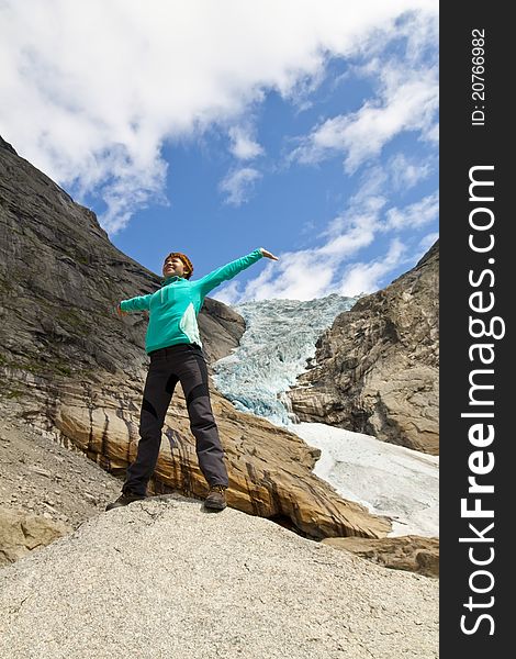 Sport girl near Bricksdal glacier in Norway. Sport girl near Bricksdal glacier in Norway