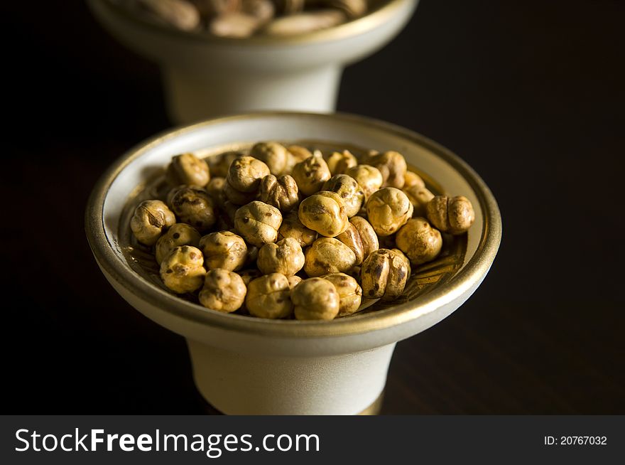 Chickpeas in the bowl, black background