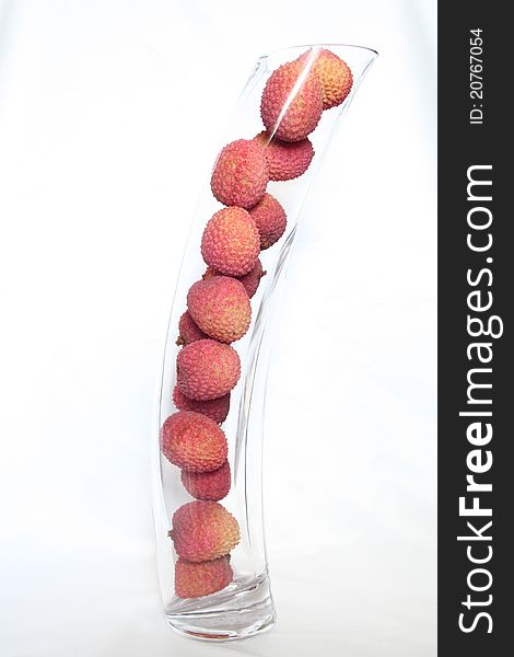 Some delicious red litchis in a long transparent. Some delicious red litchis in a long transparent
