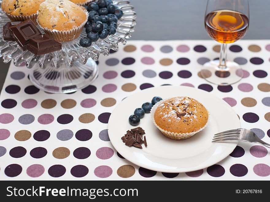 Set of chocolate muffin and passito wine