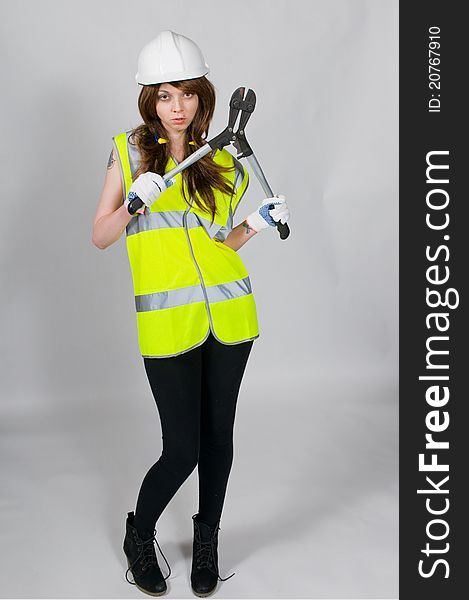 Model wearing protective clothing hold bolt croppers cutters