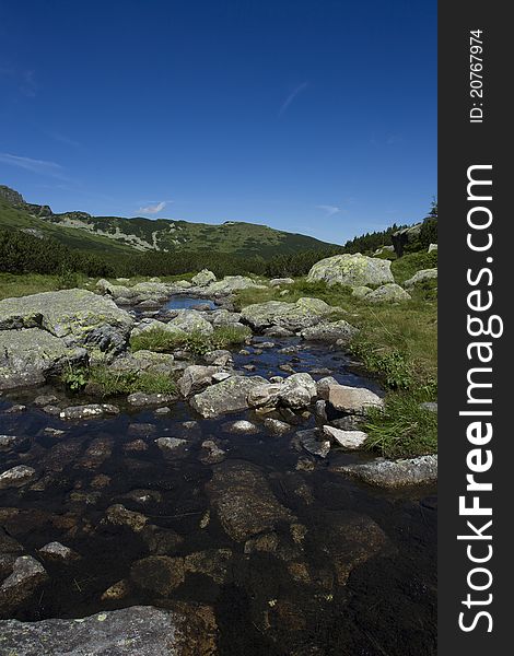 Tatra mountains and small river between. Tatra mountains and small river between.