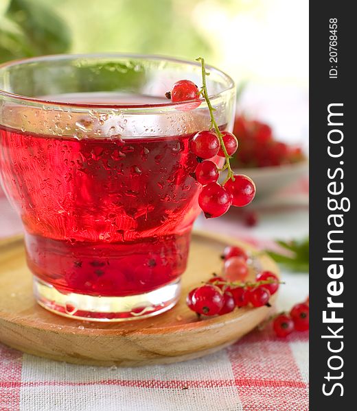 Cold drink with red currant. Selective focus