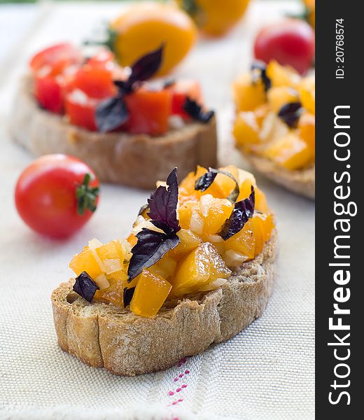 Bruschetta  with tomato, onions and freshly chopped basil, selective focus