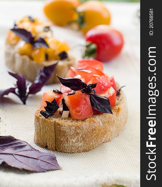 Bruschetta  with tomato, onions and freshly chopped basil, selective focus