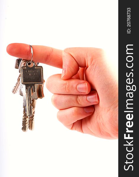 A hand with keys for a house/car. A hand with keys for a house/car