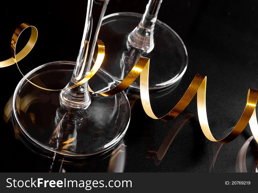 Wineglass and decoration gold ribbon. Wineglass and decoration gold ribbon