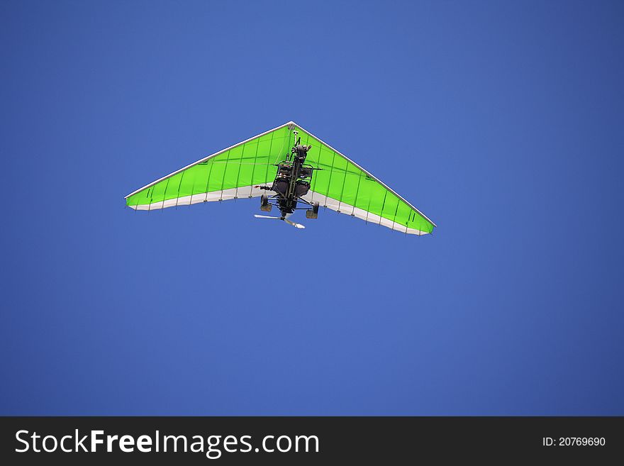 This photograph depicts a flying glider. This photograph depicts a flying glider.