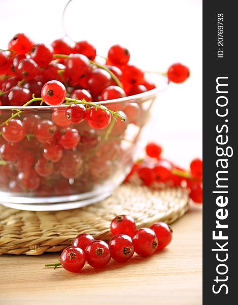 Fresh red currants in a glass bowl