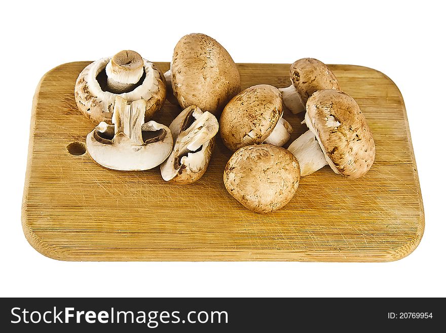 Peanut mushrooms on little plank.