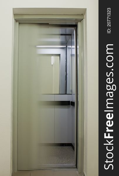 Closing elevator doors in building. Closing elevator doors in building