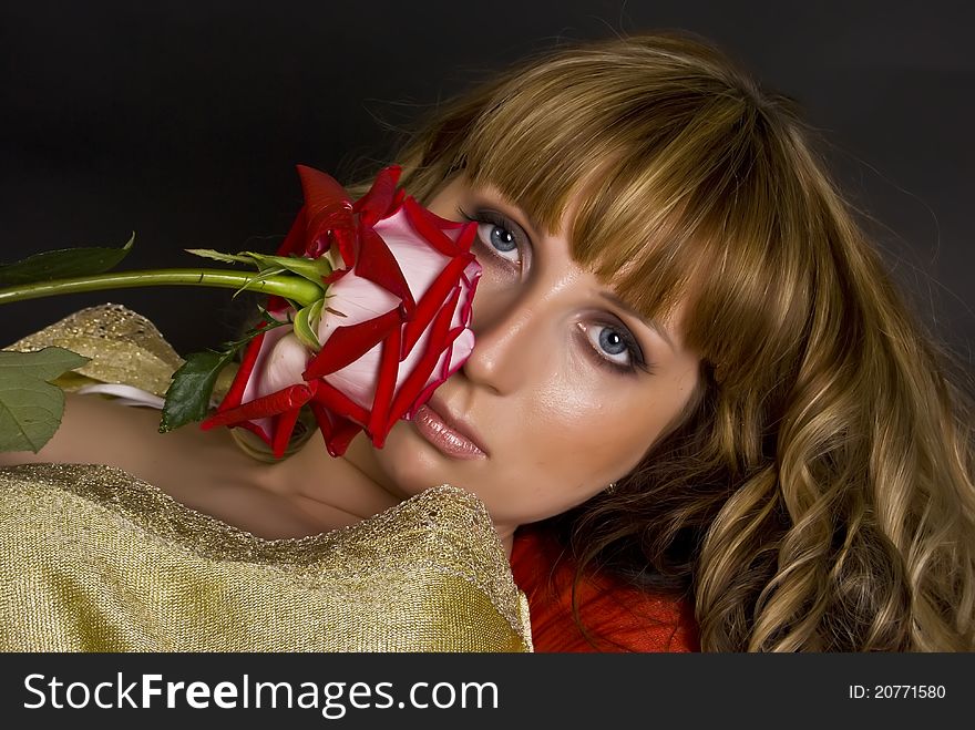 Beautiful model with a red flower