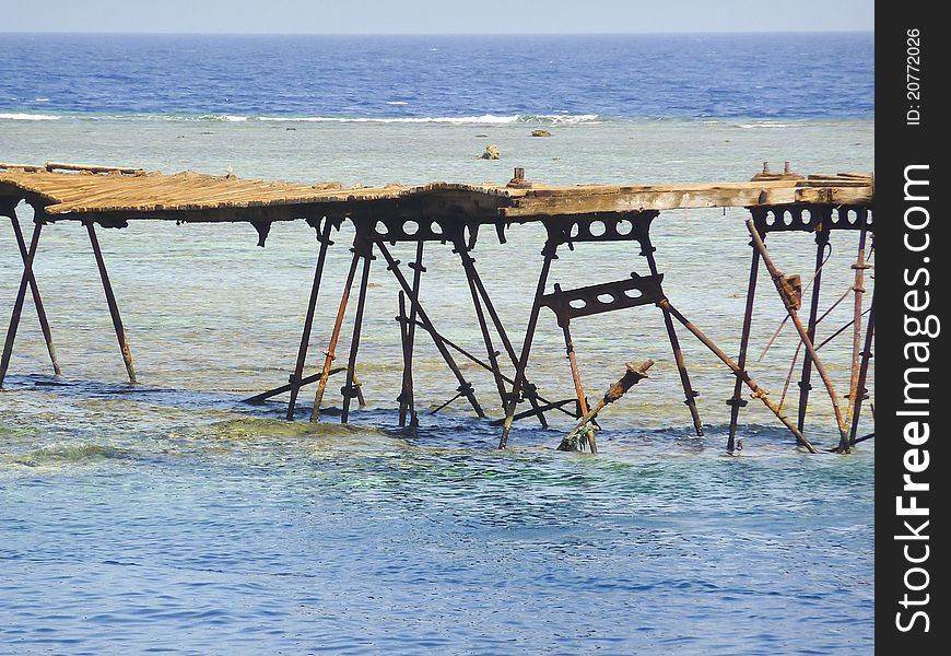 Old jetty on a coral reef