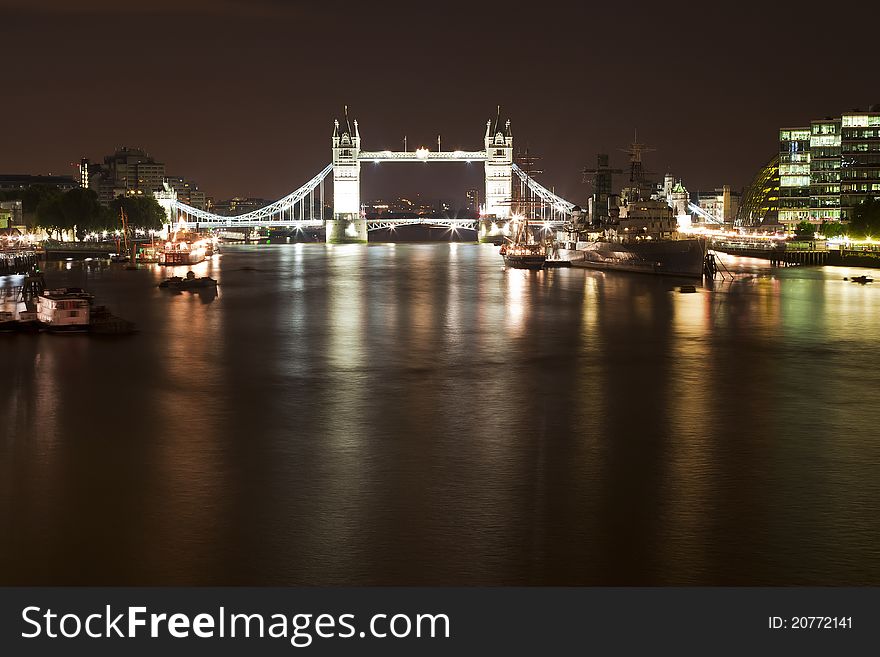 A night photo of Tower Bridge and HMS Belfast ship
