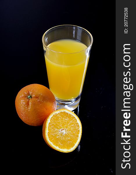 Orange Juice Glass And Sliced Orange