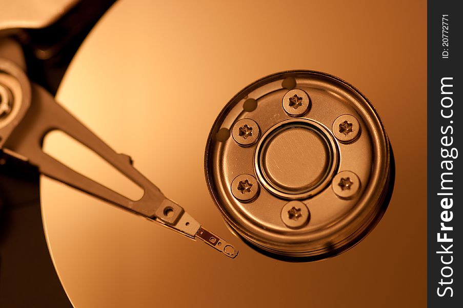 Hard drive platter with needle, up close.