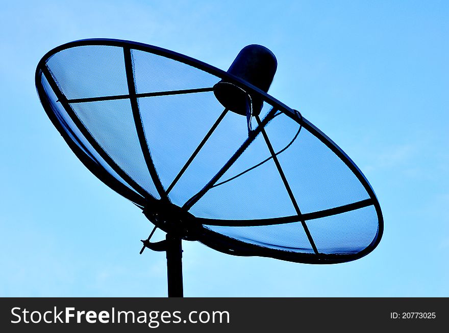 Satellite dish with evening sky