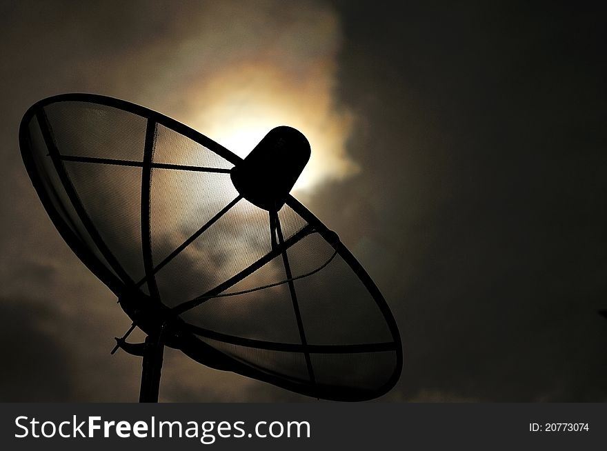 Satellite dish with midnight sky