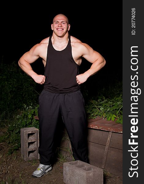 Pumped white guy posing in the backyard. Pumped white guy posing in the backyard