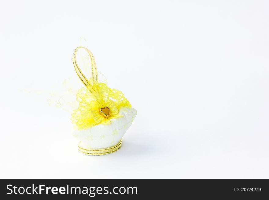 Traditional wedding souvenir with conch sculpture inside on white background