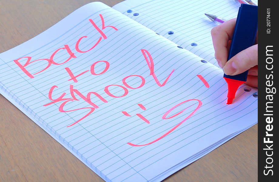 Back to school written on notepad