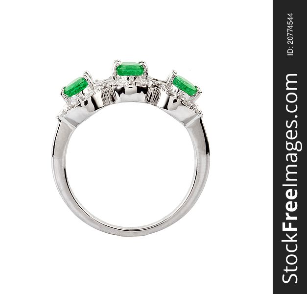 Close -up of diamond ring having big green gem over white background