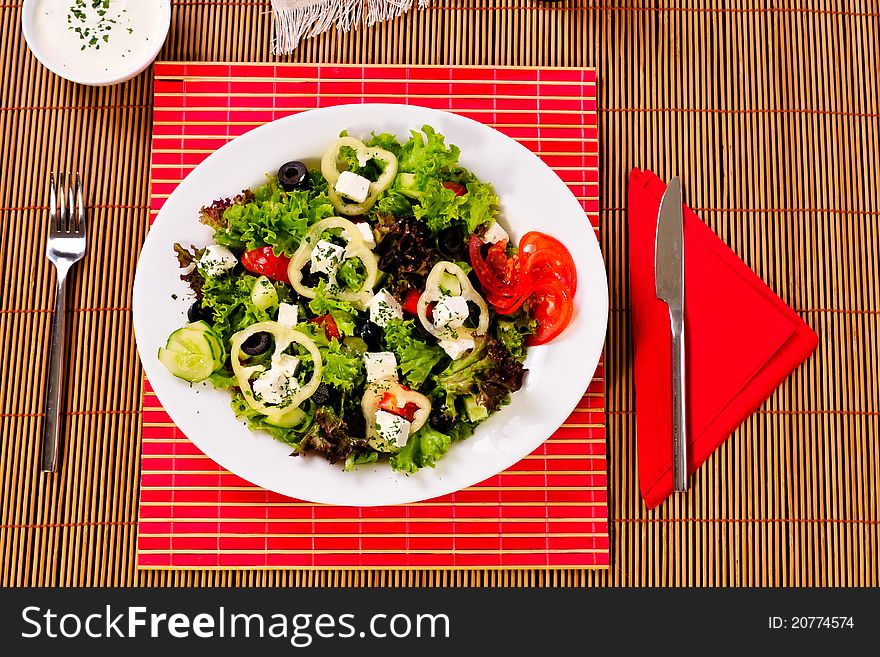 Italian frutti di mare salad on table with knife and fork. Italian frutti di mare salad on table with knife and fork