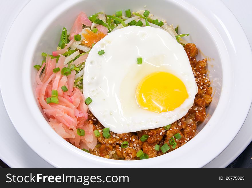 Traditional South Korean food called bibimbap spicy vegetables mix with egg