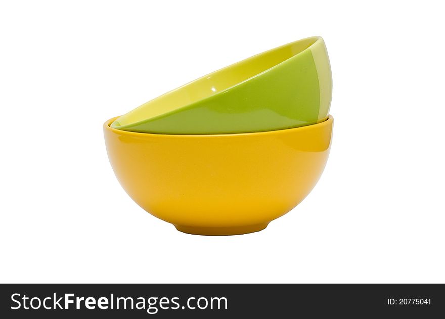 Green and yellow bowls isolated on white background