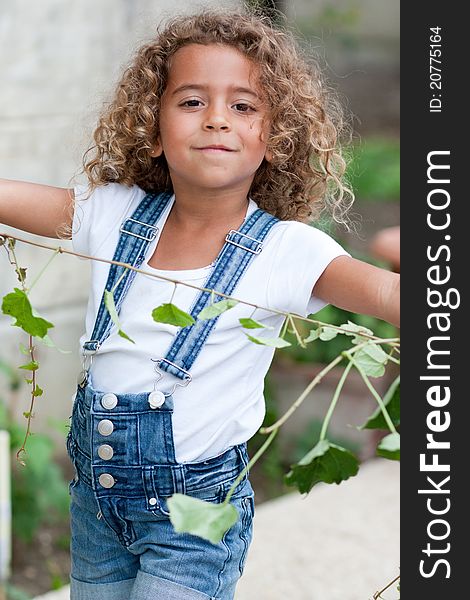 Cute little girl weeding the garden. Cute little girl weeding the garden