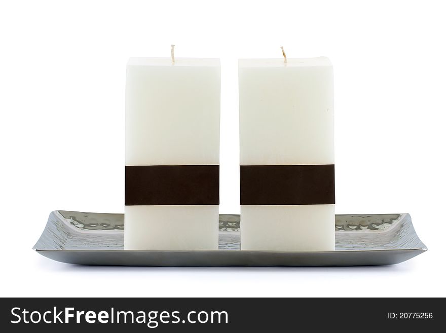 Candles on silverware tray isolated on white