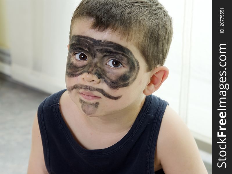 Lovely child with his face painted as El Zorro