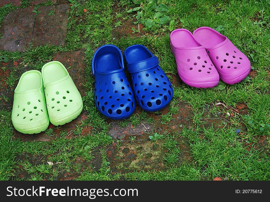 Three pairs of rubber slippers