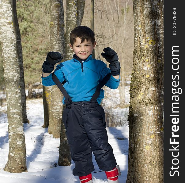 A lovely child posing on the snow. A lovely child posing on the snow