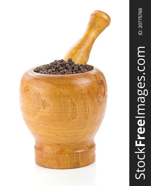 Pepper in mortar and pestle on white background
