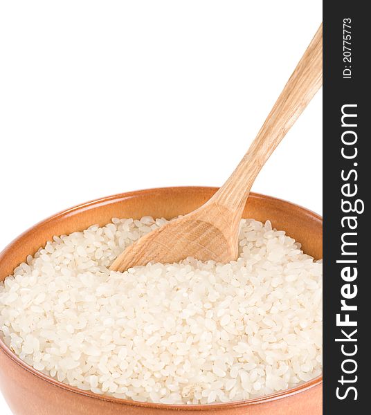 Rice in wooden plate and spoon on white background