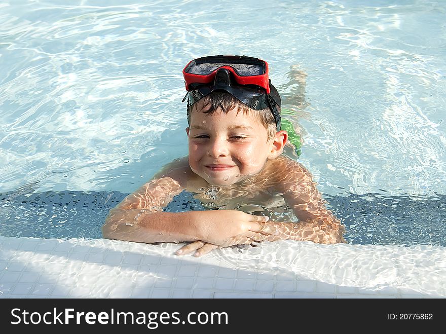 A Lovely child into the swimming pool. A Lovely child into the swimming pool