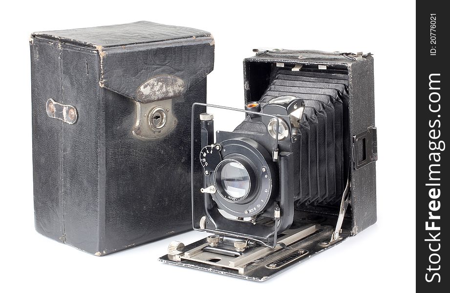 Color photo of an old camera and a cover. Color photo of an old camera and a cover