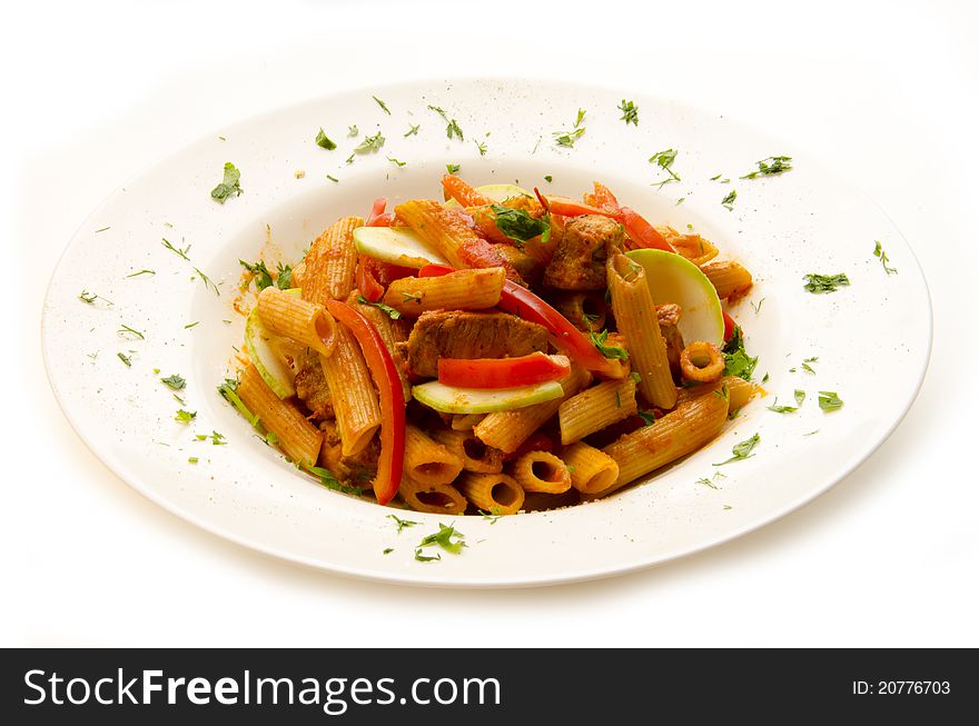 Plate of pasta with vegetables and herbs