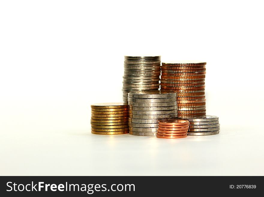 Pile of coins on white scenes. Pile of coins on white scenes.