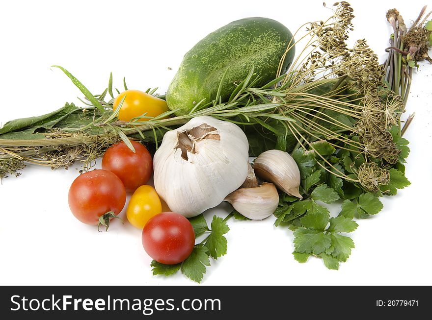 Vegetables and greens on white background