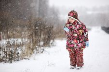Child Girl In Colorful Snowsiut Plays In Snow Stock Images Child Girl In Colorful Snowsiut Plays In Snow Stock Images