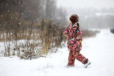 Child Girl In Colorful Snowsiut Plays In Snow Stock Images Child Girl In Colorful Snowsiut Plays In Snow Stock Images