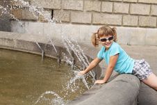 Little Girl Playing With Water - The Fountain Stock Photos