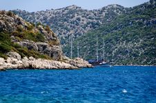 The Yacht In Harbor Among Rocks And Blue Sea Royalty Free Stock Photos The Yacht In Harbor Among Rocks And Blue Sea Royalty Free Stock Photos
